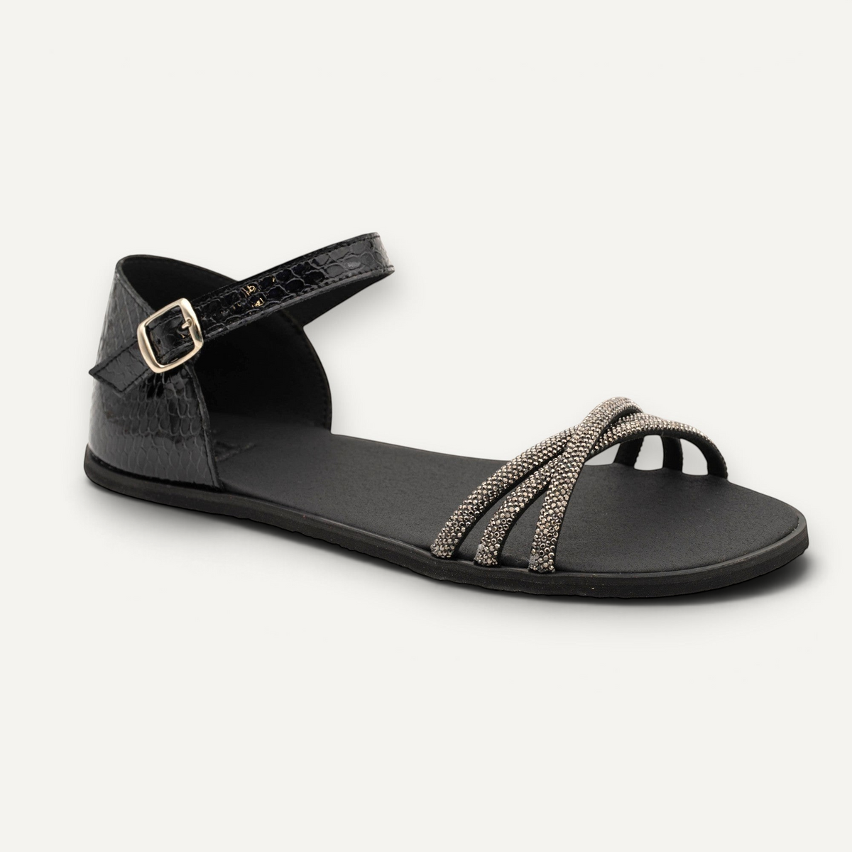 Sandalia barefoot Flexinens en color plomo y negro con tiras brillantes y cierre de hebilla de la marca zoireo
